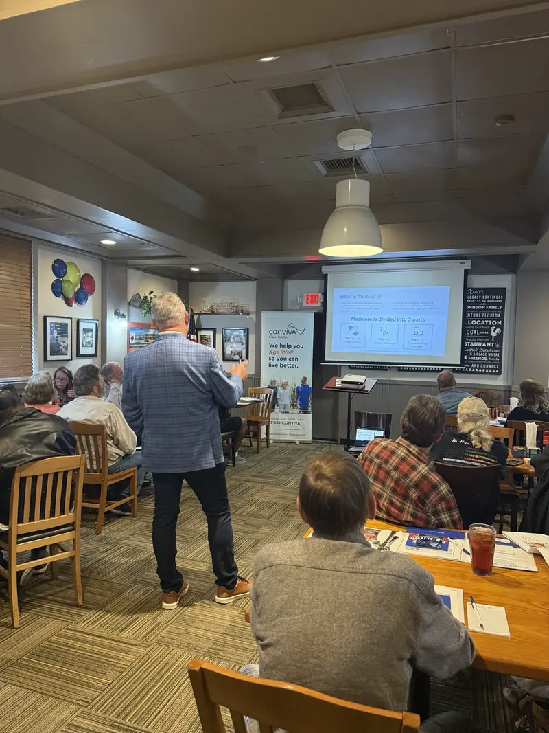 Steve Thornton presenting to seminar guests seated at tables